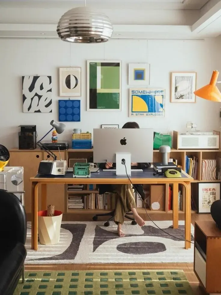 A home office and garage watched by a phone camera